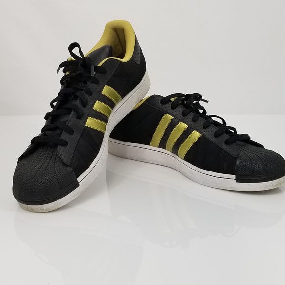 black and gold adidas shell toes